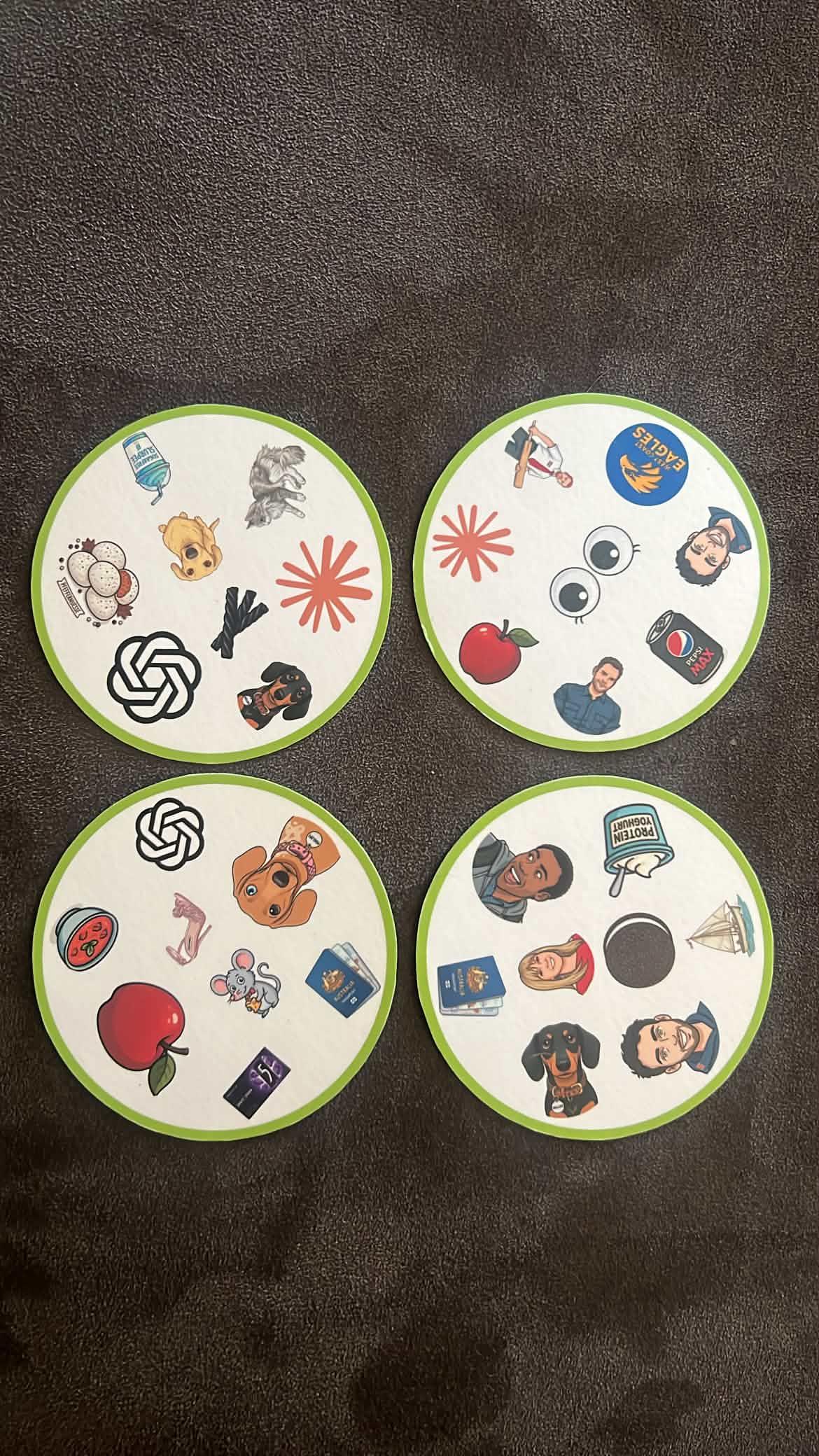 Authentic printed circular Match It cards spread on wood table
